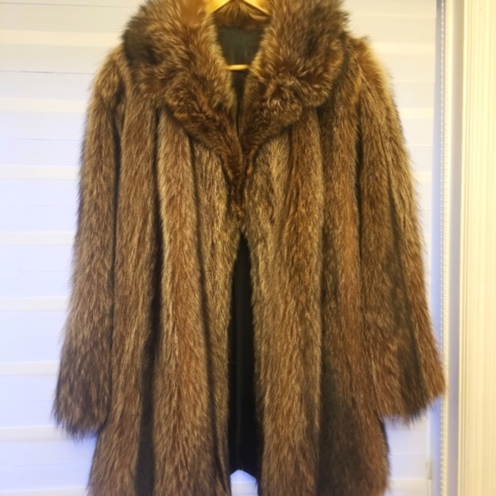 Racoon Jacket vintage size 10-12. Length to upper thigh.